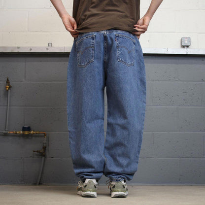 Y2K Levi’s 550 jeans tapered leg blue Loose relaxed fit denim pants red tab logo