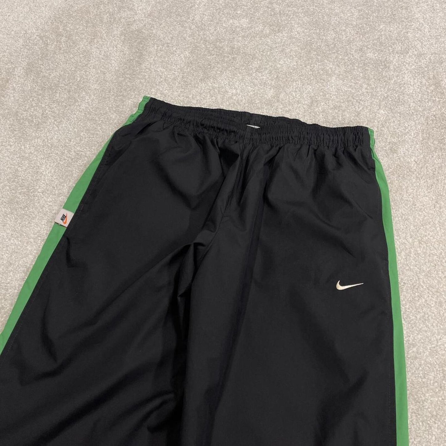 Vintage baggy Nike tracksuit bottoms black Wide leg mesh lined embroidered side stripe track pants