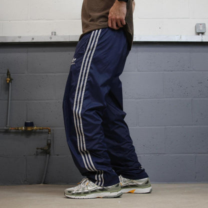 Adidas tracksuit bottoms loose leg navy Vintage mesh lined embroidered side stripe track pants