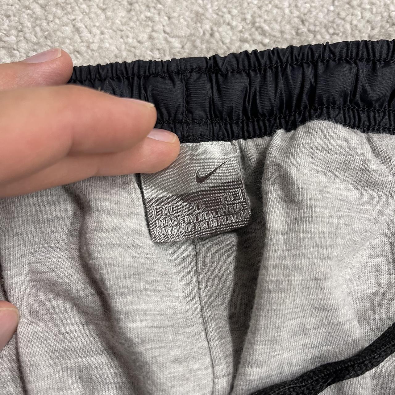 Vintage Nike baggy tracksuit bottoms Y2K black Wide leg lined embroidered side stripe track pants