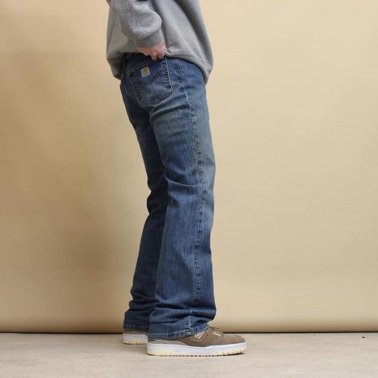 Blue Carhartt jeans size 12 (W34) traditional fit bootcut denim jeans patch logo