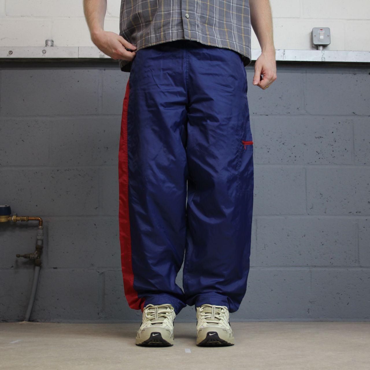 Y2K vintage Nike baggy tracksuit bottoms navy Loose leg 2000s style casual swoosh logo track pants