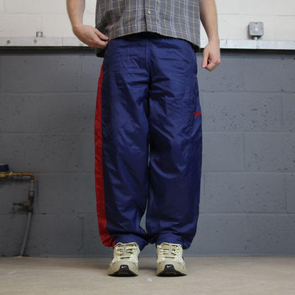 Y2K vintage Nike baggy tracksuit bottoms navy Loose leg 2000s style casual swoosh logo track pants