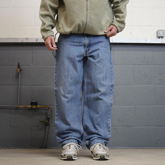 Vintage Y2K Levi’s 550 jeans blue W38L36 Loose straight leg 00s style denim pants red tab logo
