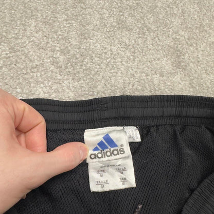 Vintage Y2K Adidas tracksuit bottoms black Loose leg mesh lined side stripe track pants