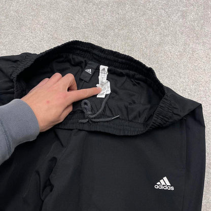 Black Adidas trackies Large y2k loose style sportswear track pants embroidered side stripe design