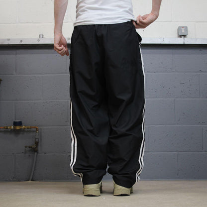 Vintage Adidas tracksuit bottoms loose black Loose floaty embroidered side stripe track pants