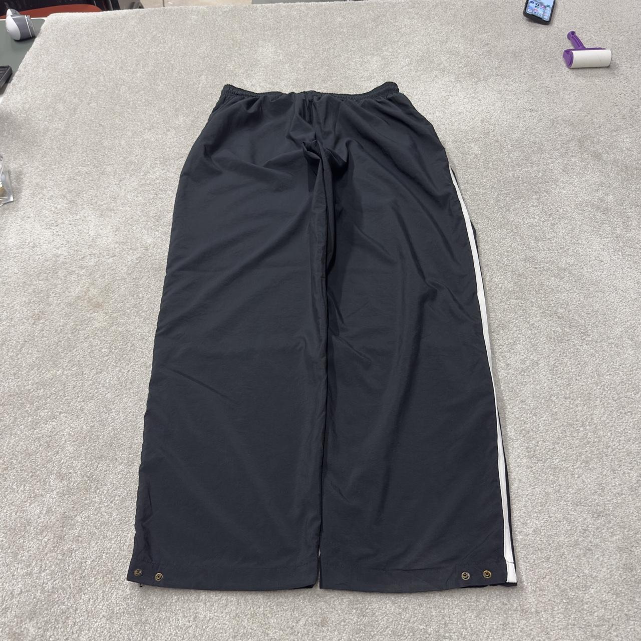 Nike extra baggy tracksuit bottoms wide leg black Nike Team lined embroidered stripe track pants