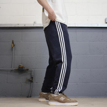 Vintage navy Adidas joggers M y2k style sportswear track pants side stripe design