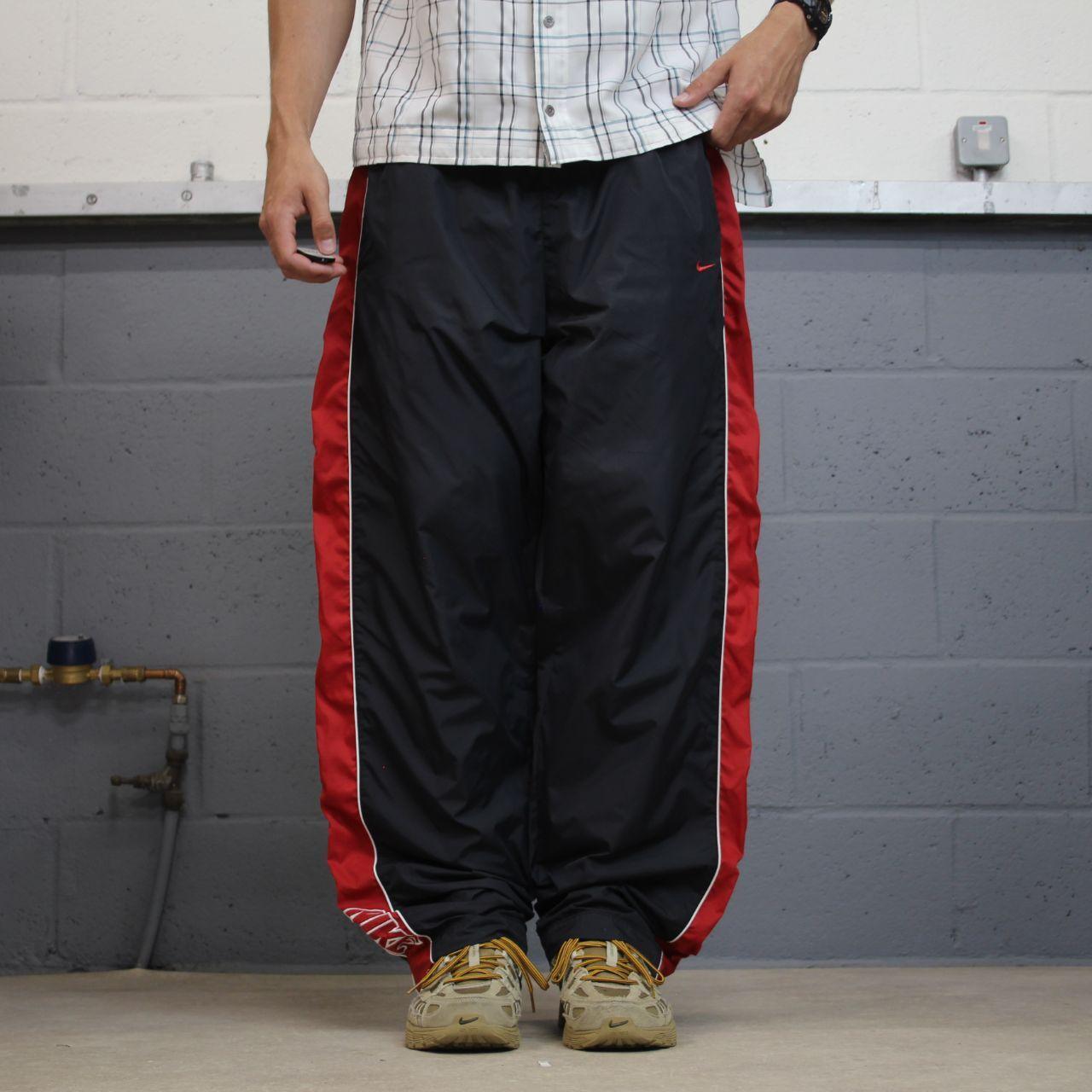 Vintage Nike baggy tracksuit bottoms Y2K black Wide leg lined embroidered side stripe track pants