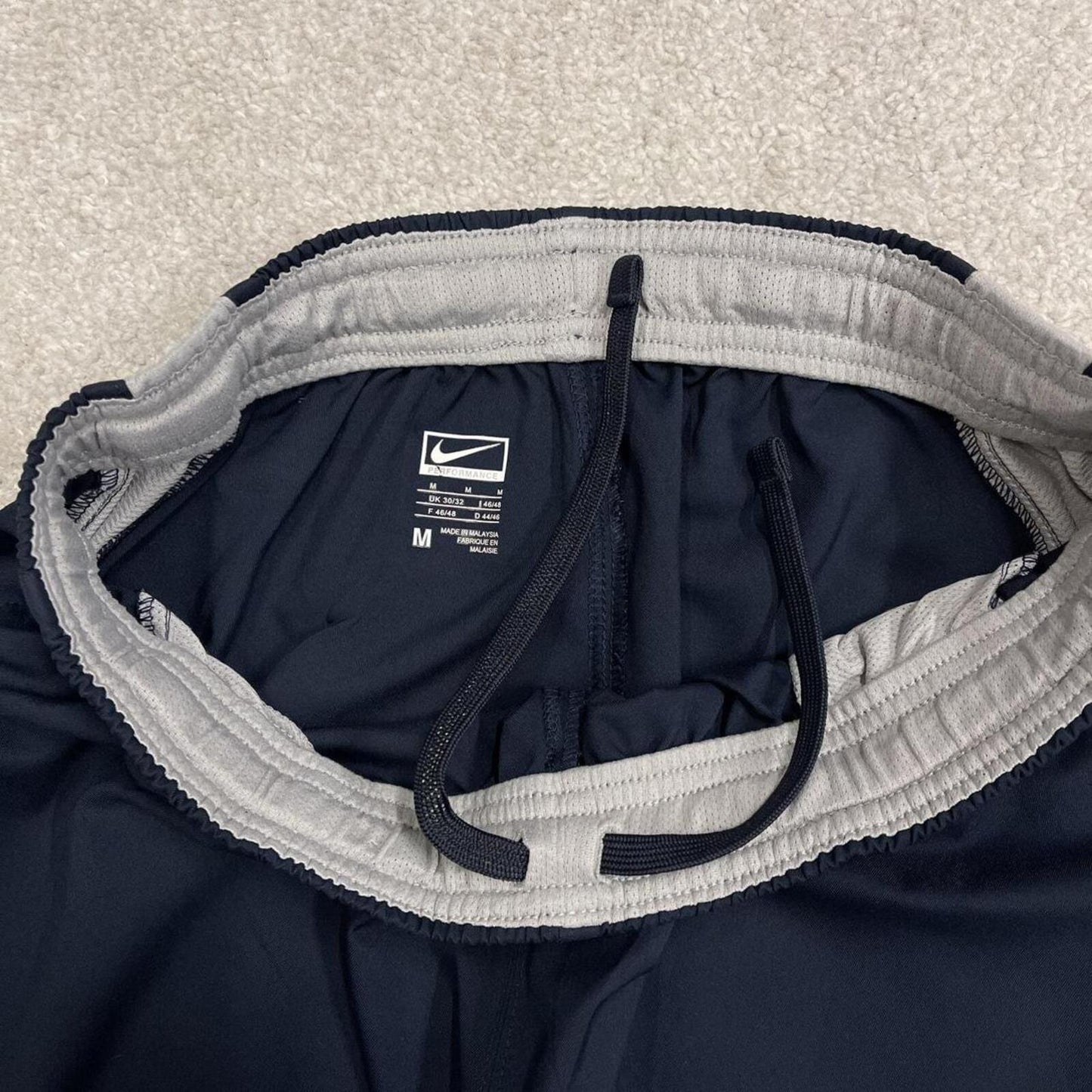 Nike tracksuit bottoms wide leg navy Floaty unlined embroidered side stripe track pants