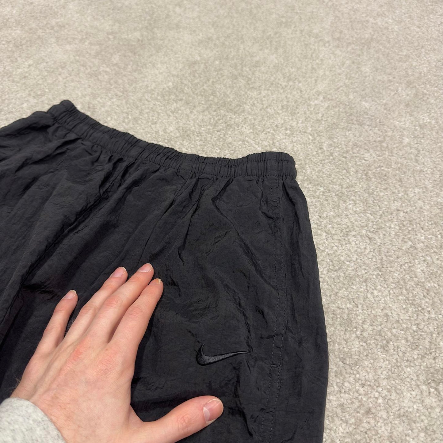 Vintage Nike tracksuit bottoms y2k black medium floaty leg unlined swoosh logo gym wear track pants