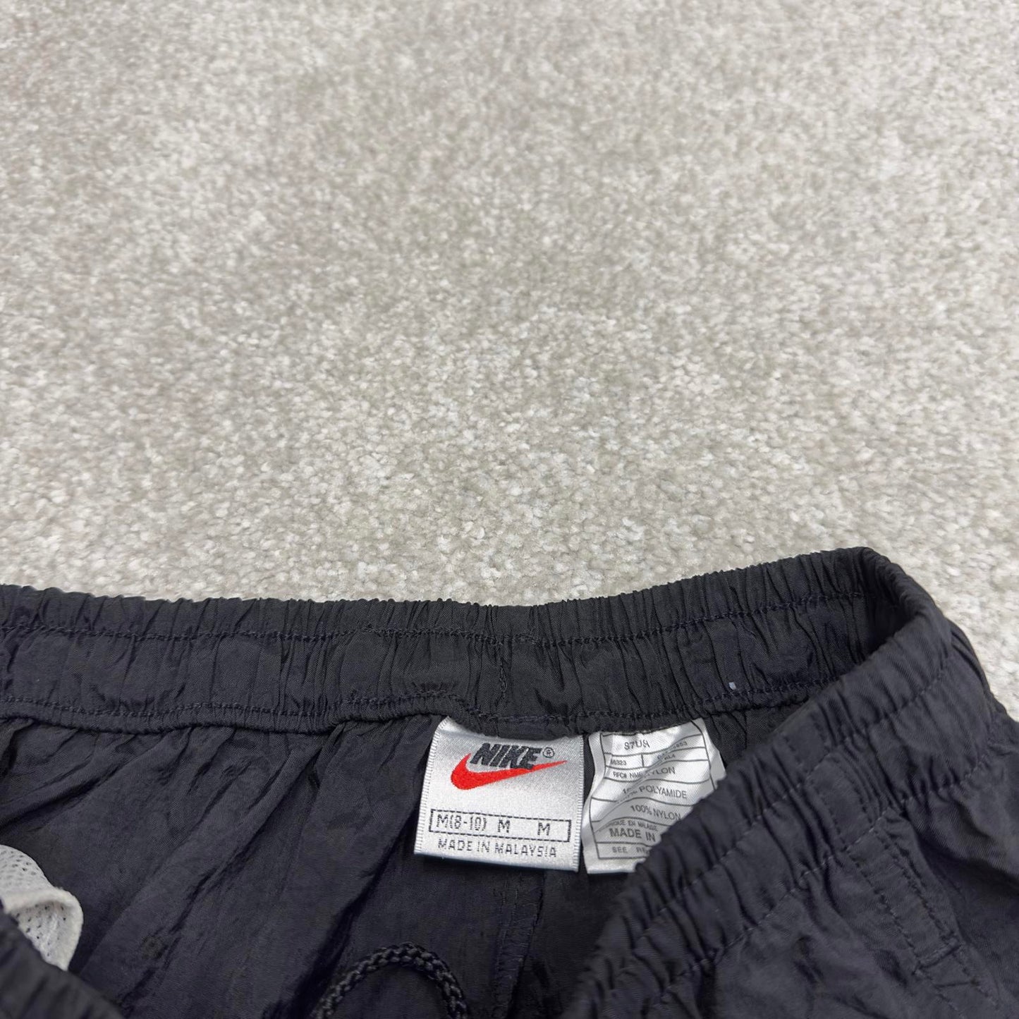 Vintage Nike tracksuit bottoms y2k black medium floaty leg unlined swoosh logo gym wear track pants