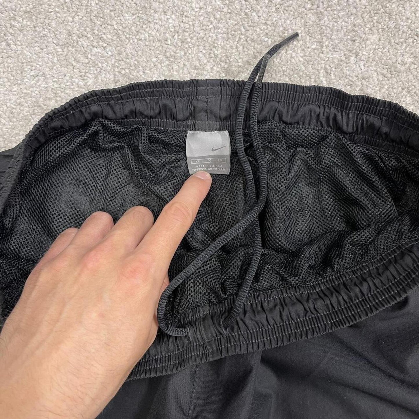 Vintage baggy Nike tracksuit bottoms black Wide leg mesh lined embroidered side stripe track pants