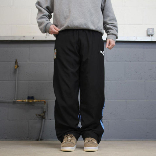 Vintage Y2K baggy PUMA tracksuit bottoms black Loose wide leg lined track pants with blue accents