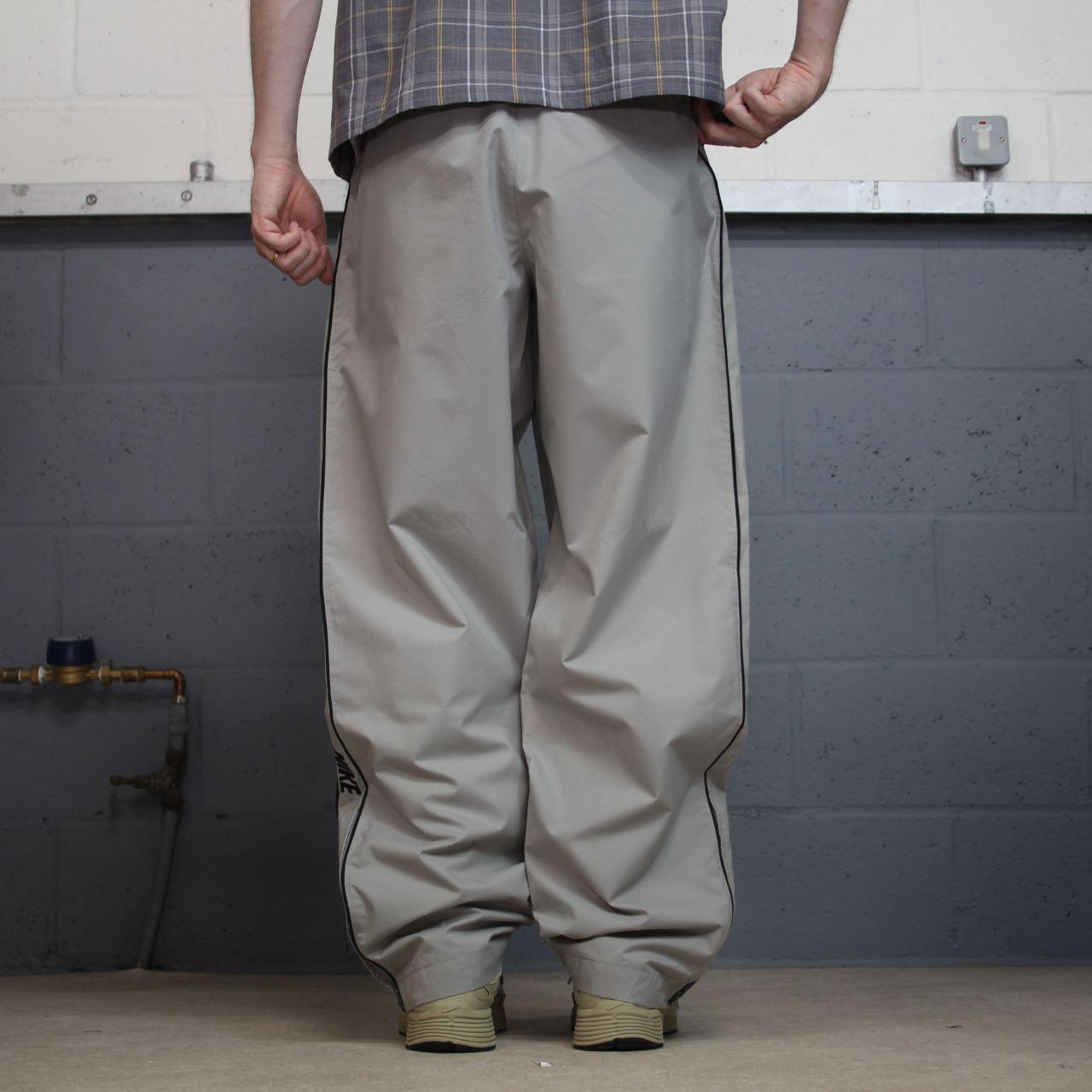 Vintage Nike baggy tracksuit bottoms Y2K grey Wide leg lined embroidered side stripe track pants