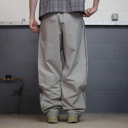 Vintage Nike baggy tracksuit bottoms Y2K grey Wide leg lined embroidered side stripe track pants