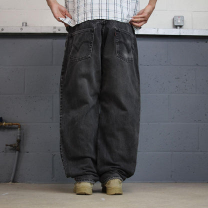 Levi’s 550 jeans Y2K relaxed fit denim faded black Levi’s loose leg 2000s style pants red tab logo