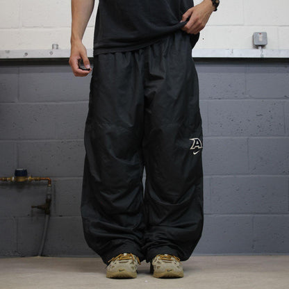 Nike baggy tracksuit bottoms wide leg charcoal Storm-Fit lined embroidered cuffable track pants