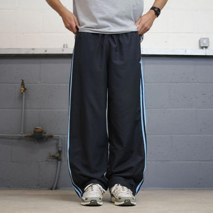 Vintage Womens navy Adidas joggers 22 y2k style sportswear track pants side stripe design