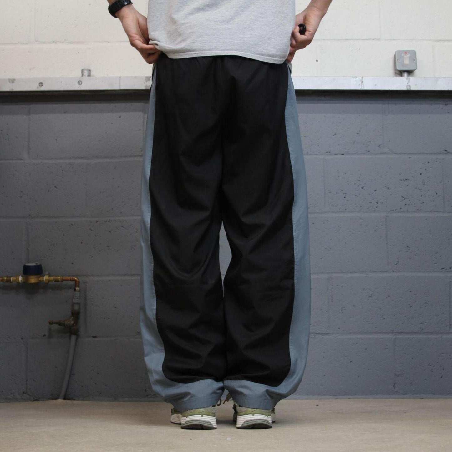 FILA tracksuit bottoms loose leg black Vintage lined embroidered side stripe track pants