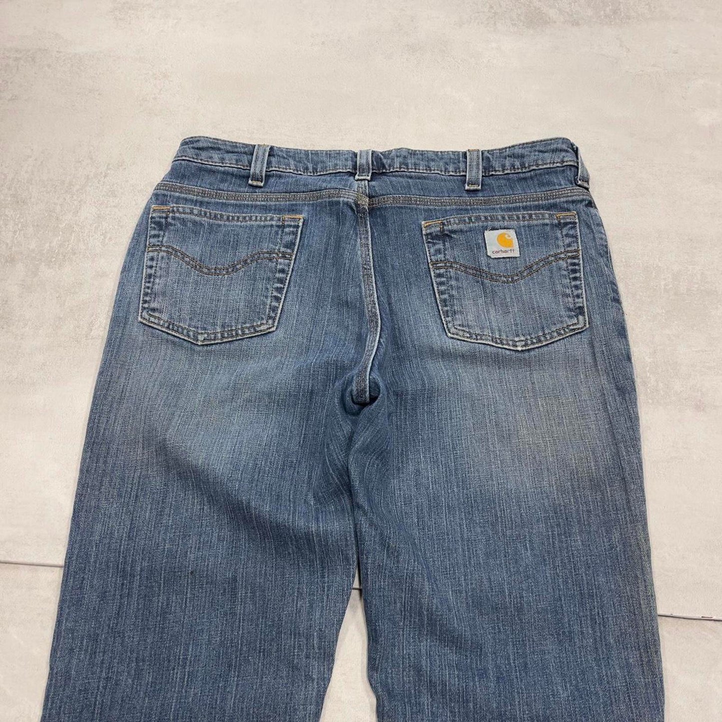 Blue Carhartt jeans size 12 (W34) traditional fit bootcut denim jeans patch logo