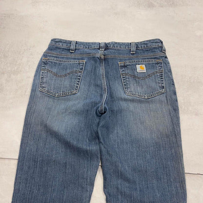 Blue Carhartt jeans size 12 (W34) traditional fit bootcut denim jeans patch logo