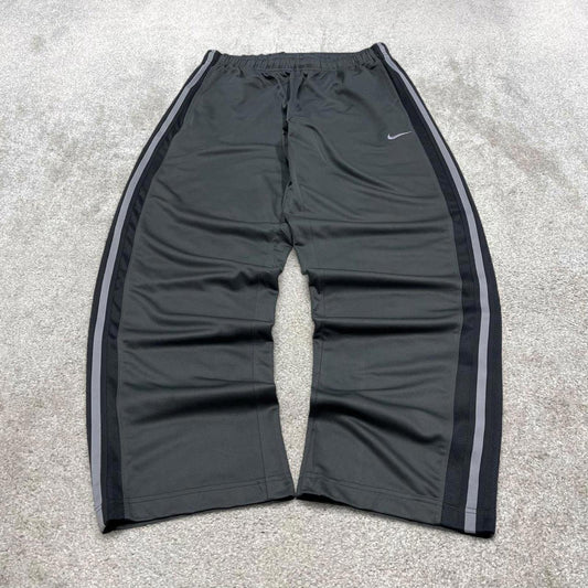 Grey baggy Nike trackies L loose y2k style joggers embroidered Swoosh logo track pants side stripes