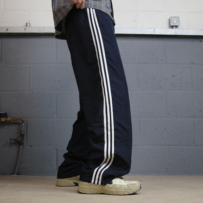 Baggy women’s Y2K Adidas tracksuit bottoms navy mesh lined side stripe embroidered logo track pants