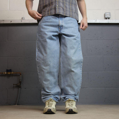 Vintage Levi’s baggy jeans y2k W34L32 washed blue Levi’s 550 relaxed fit surf style pants red tab