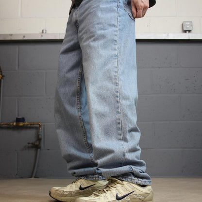 Vintage Levi’s baggy jeans y2k W34L32 washed blue Levi’s 550 relaxed fit surf style pants red tab