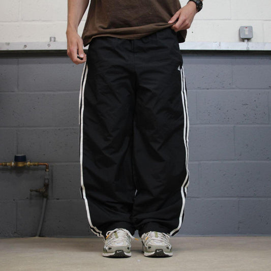 Baggy Adidas tracksuit bottoms wide leg black Loose lined embroidered side stripe track pants