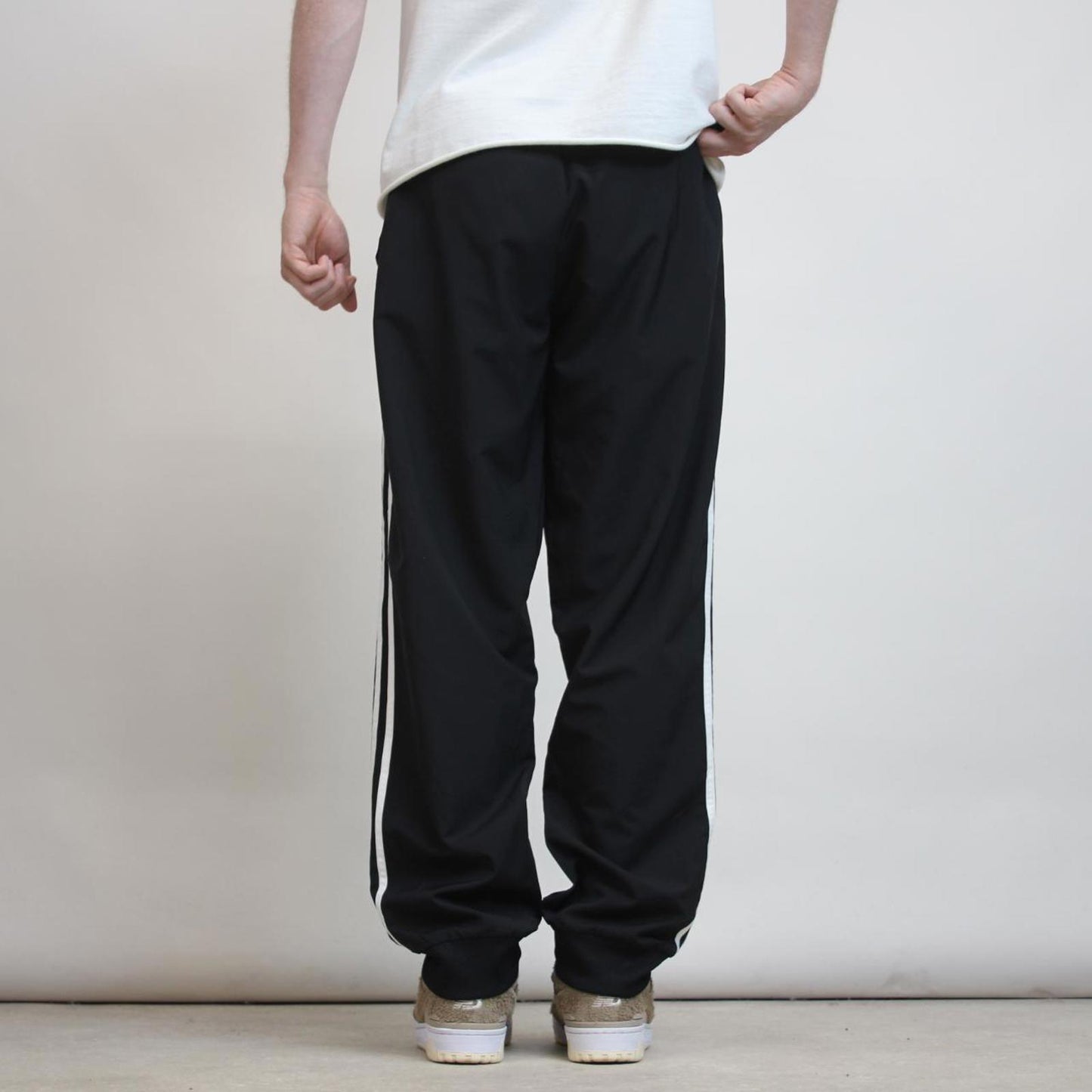 Adidas Trackies L black y2k track bottoms embroidered logo side stripe design