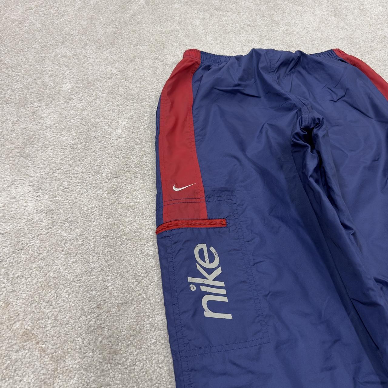 Y2K vintage Nike baggy tracksuit bottoms navy Loose leg 2000s style casual swoosh logo track pants