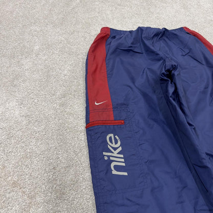 Y2K vintage Nike baggy tracksuit bottoms navy Loose leg 2000s style casual swoosh logo track pants