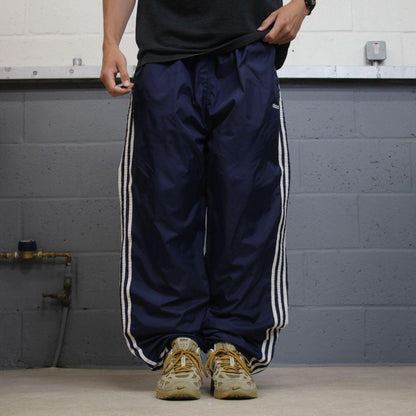 Vintage Y2K baggy Adidas tracksuit bottoms navy Loose-leg embroidered lined side stripe track pants