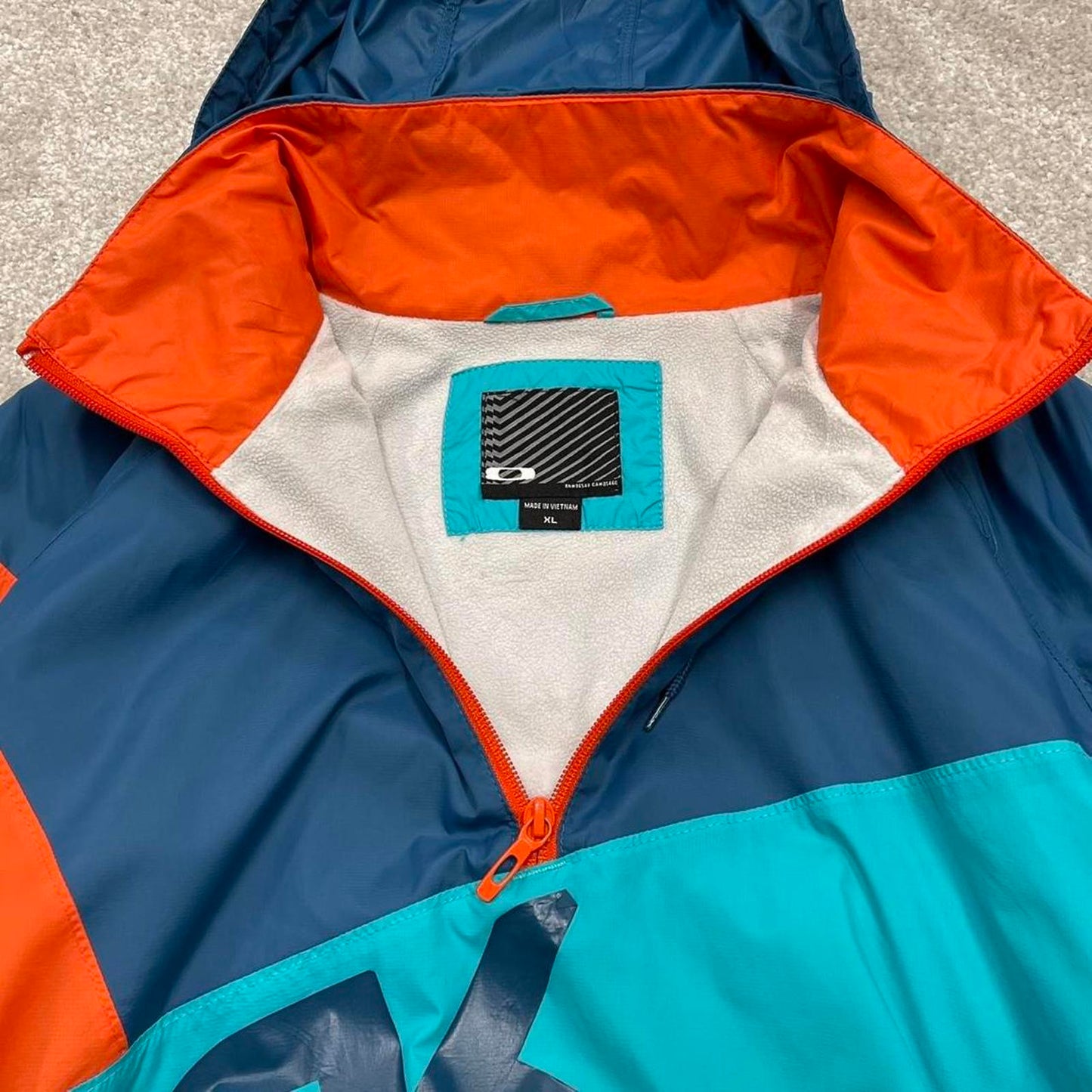00s Oakley technical windbreaker jacket XL men's y2k style blue lightweight hooded fleece tech coat