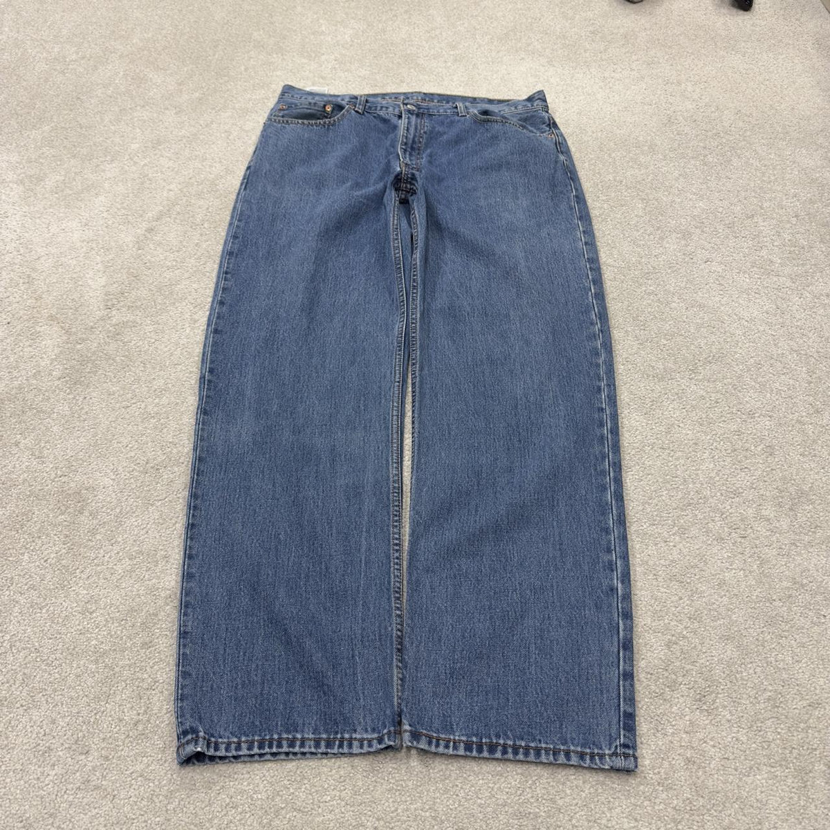 Levi’s 550 jeans Y2K blue denim loose leg 2000s style pants red tab logo
