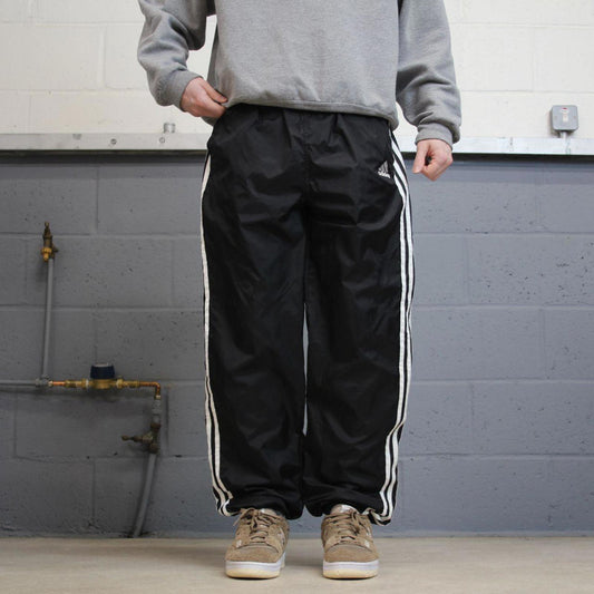 Vintage Y2K Adidas tracksuit bottoms black Loose embroidered side stripe track pants