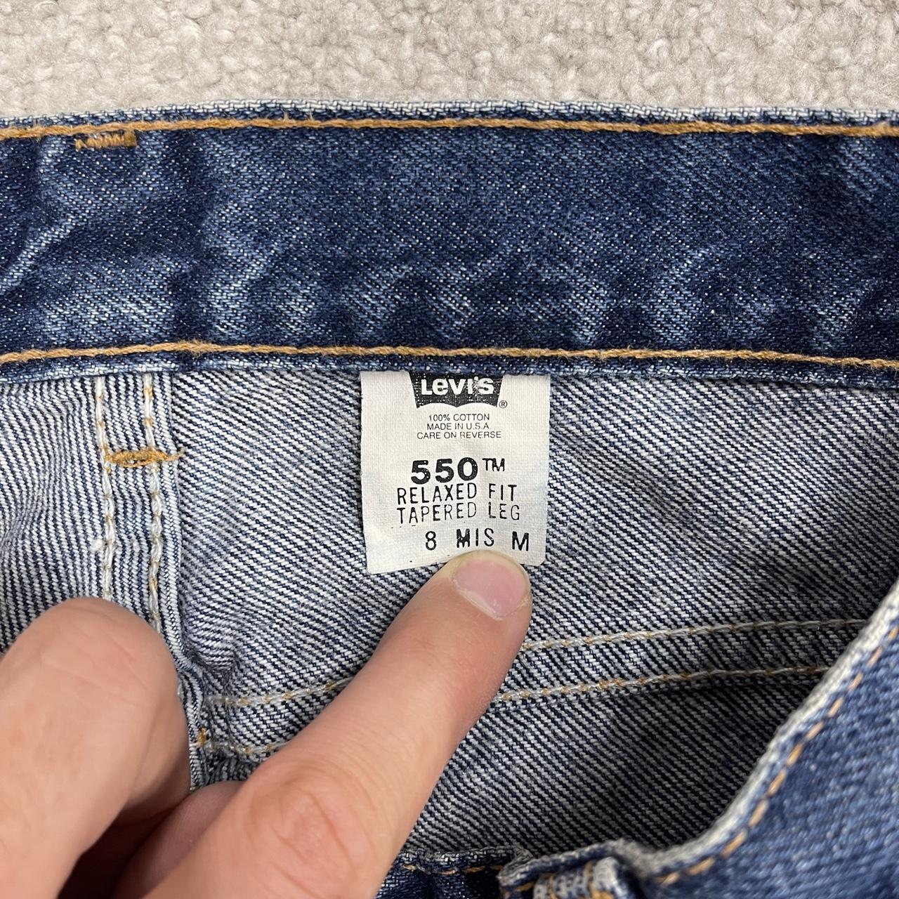 Y2K vintage Levi’s 550 jeans W26L31 blue Relaxed fit tapered leg 5 pocket pants red tab logo