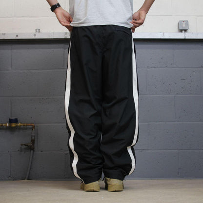 Nike tracksuit bottoms Y2K black Loose fit mesh lined embroidered side stripe track pants