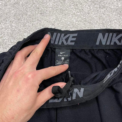 00s Nike tracksuit bottoms y2k M loose black joggers print Swoosh logo gym wear trackies