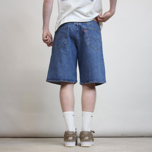 Vintage mens Levi’s 550 jorts W34 blue denim loose 90s style skater shorts