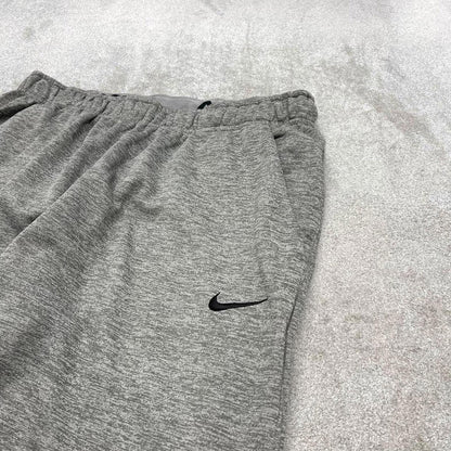 Y2K Nike loose sweatpants joggers grey Swoosh logo fleece lined gym drawstring track pants