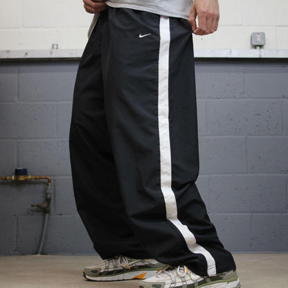 Baggy Nike tracksuit bottoms black Wide leg mesh lined embroidered side stripe track pants
