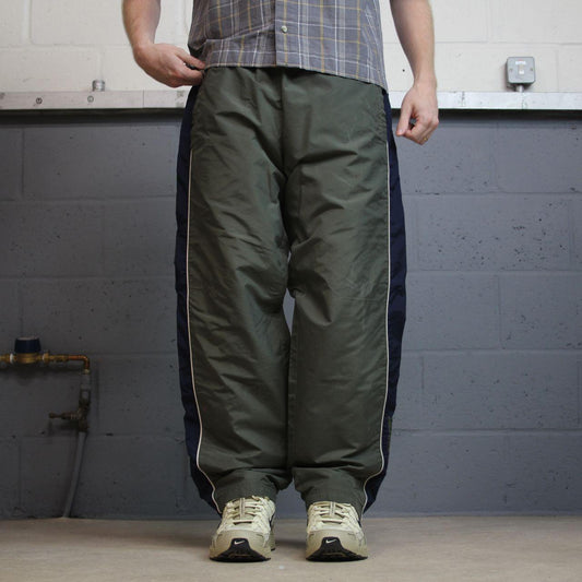 Vintage Nike tracksuit bottoms Y2K green Loose fit lined embroidered side stripe track pants