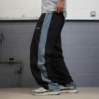 FILA tracksuit bottoms loose leg black Vintage lined embroidered side stripe track pants
