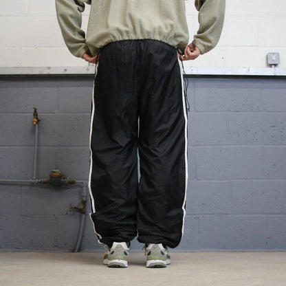 Black Adidas tracksuit bottoms Large y2k style sportswear track pants side stripe design