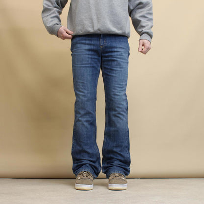 Blue Carhartt jeans size 8 W30L34 original fit bootcut denim jeans patch logo