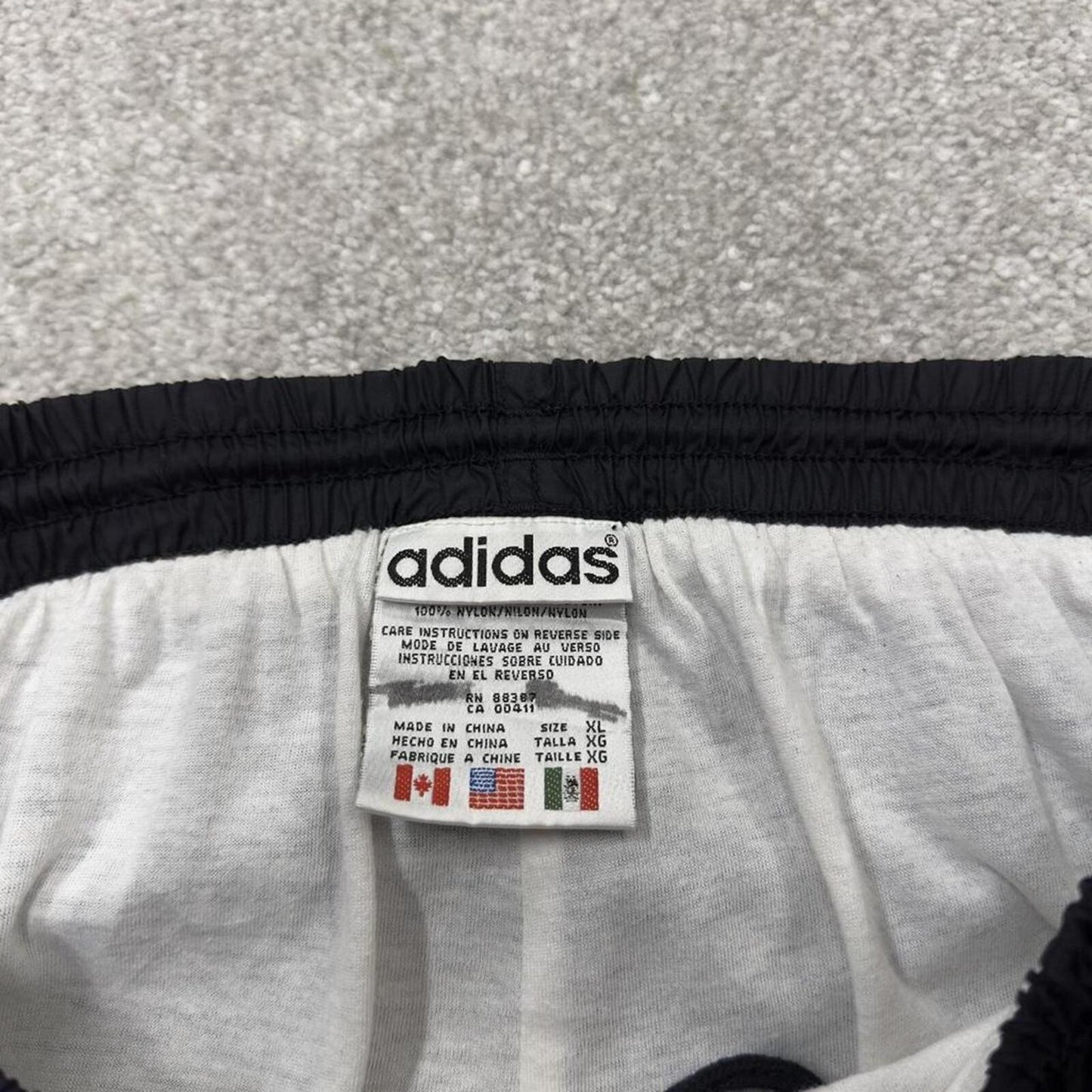 Vintage Adidas tracksuit bottoms loose black Loose floaty embroidered side stripe track pants
